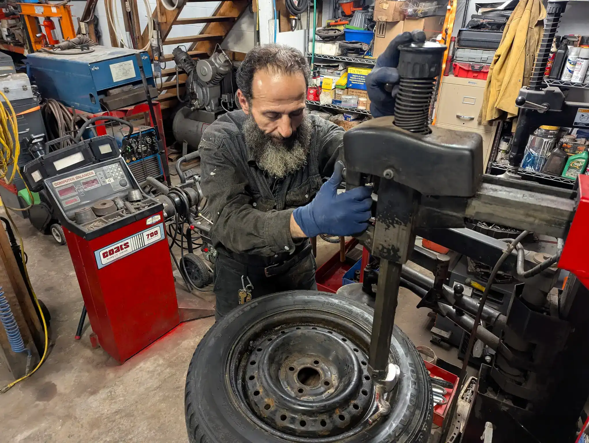 Ghassan checking an engine